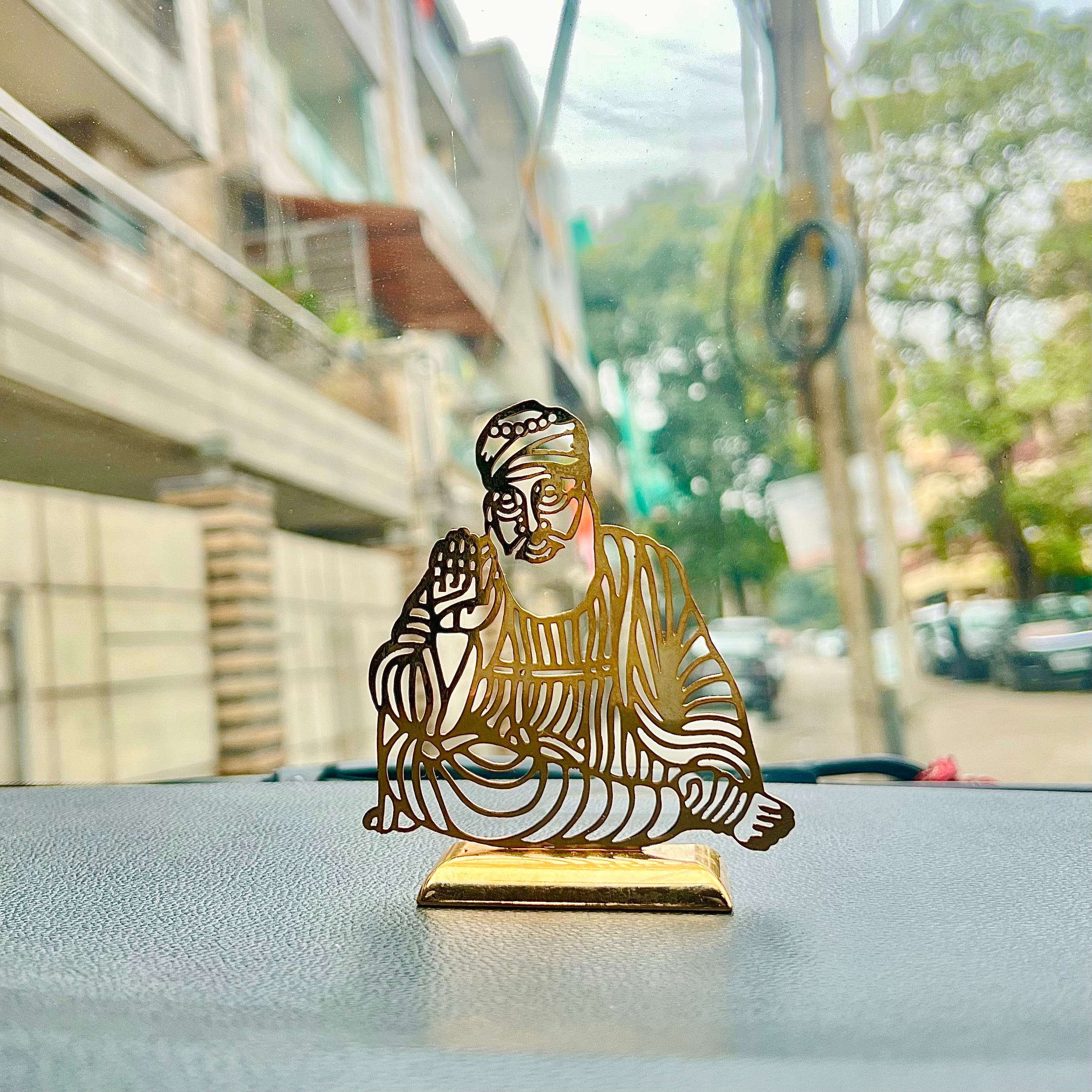 Baba NanakA beautifully crafted accessory, perfect for adding blessings and grace to your car's dashboard, serving as a decorative centerpiece on your table, or even adding chHindustanwaleBaba Nanak