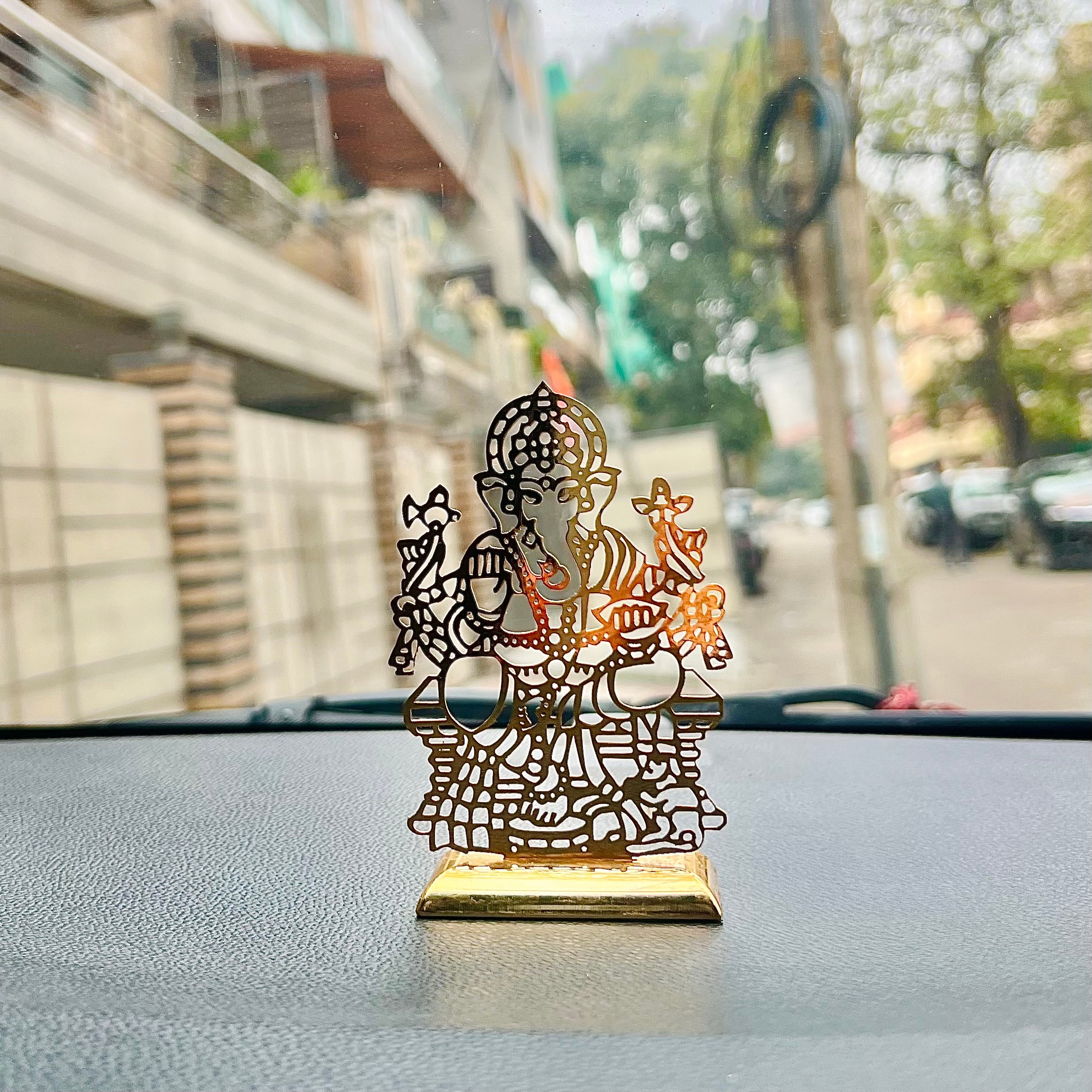 My friend GaneshaA beautifully crafted accessory, perfect for adding blessings and grace to your car's dashboard, serving as a decorative centerpiece on your table, or even adding chHindustanwalefriend Ganesha